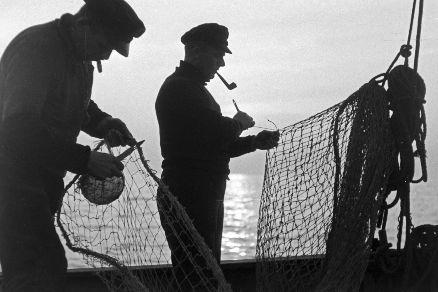 black and white vintage shot of fishing captains
