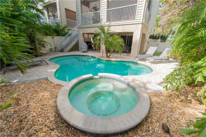 Pool in the backyard of this Holmes Beach vacation rental