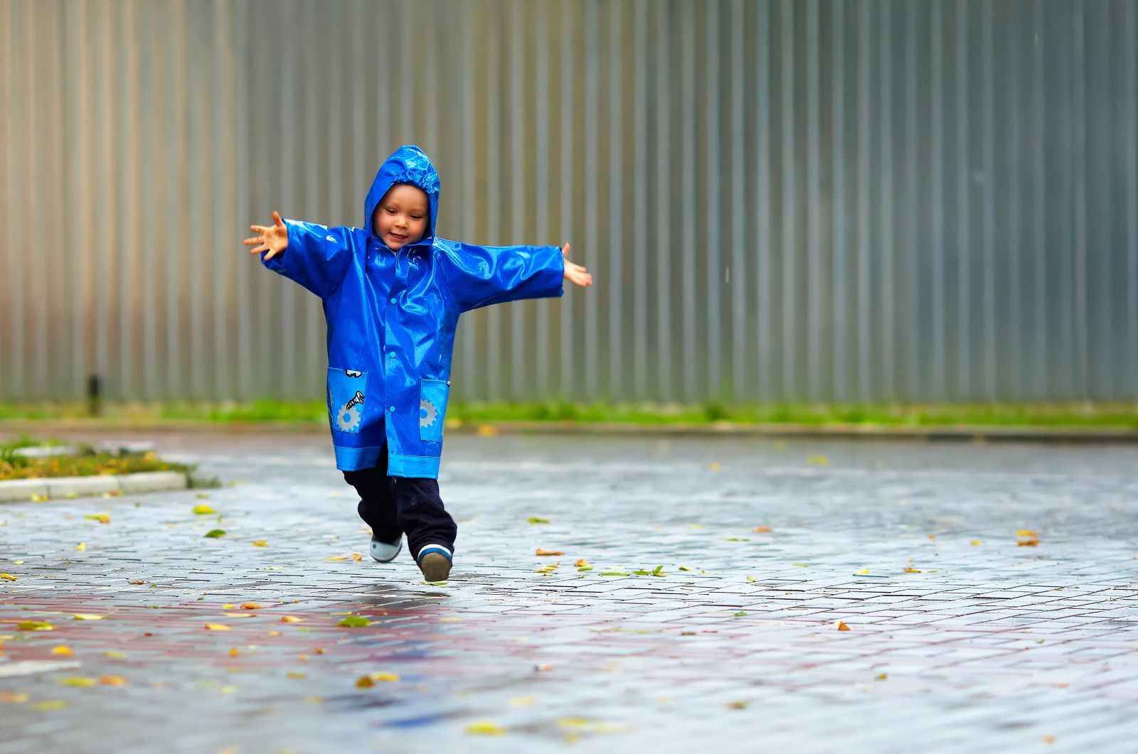 kid running in the rain