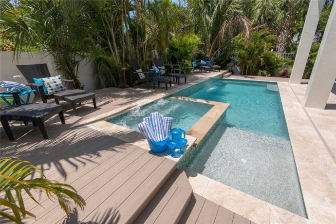 Exterior of pool with large deck in Anna Maria Island 