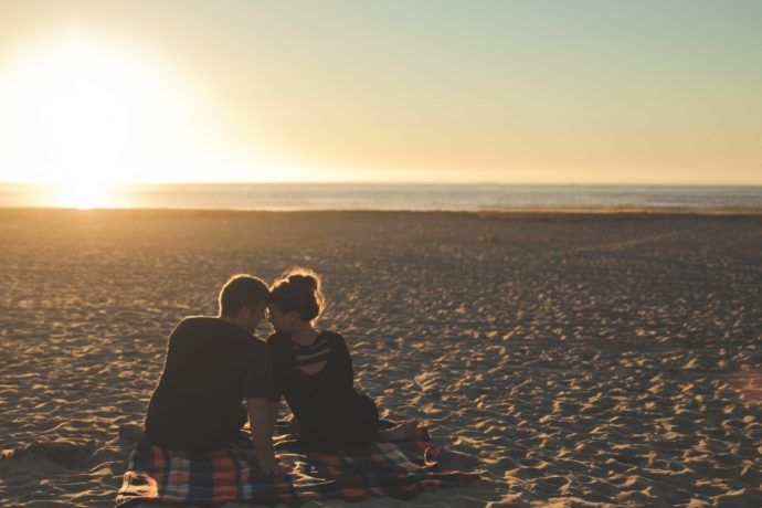 Couple watching sunset on Bradenton Beach