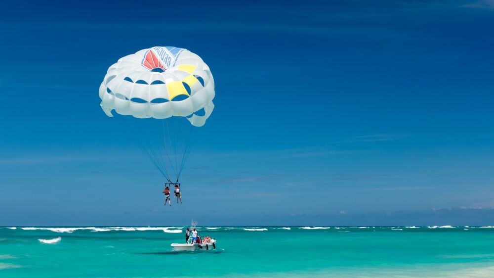 parasailing over ocean by anna maria island