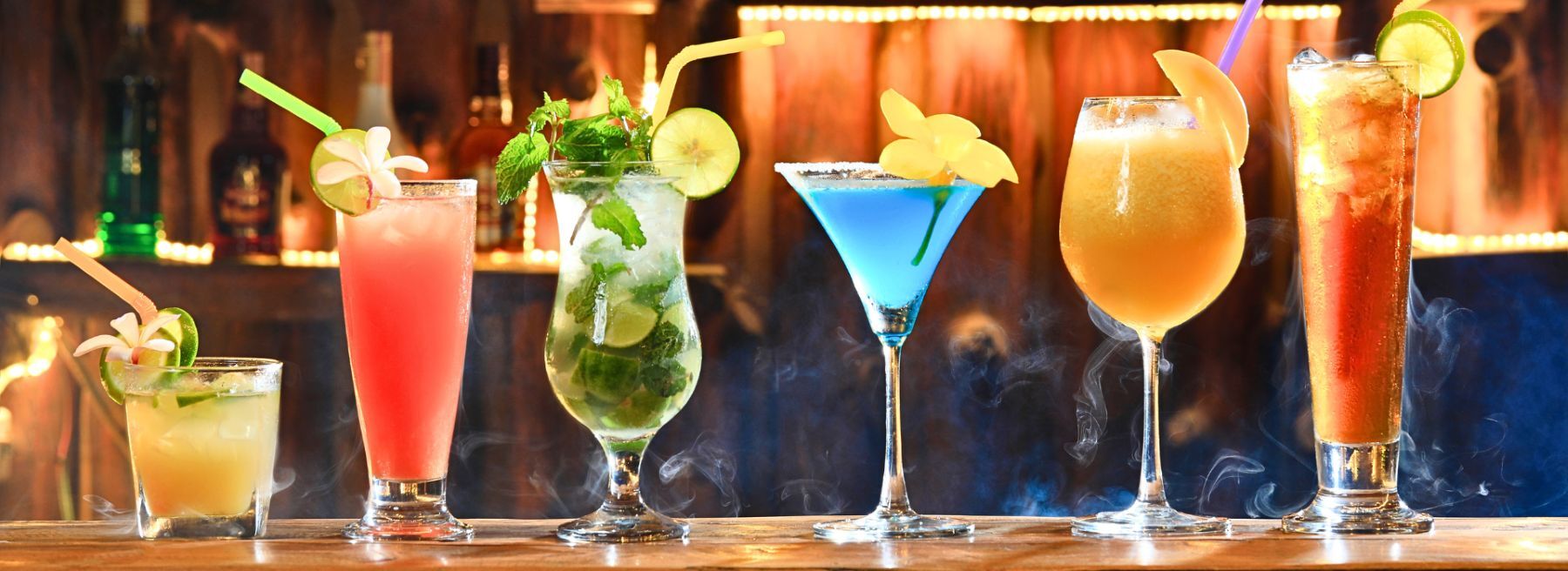 cocktails displayed on edge of bar